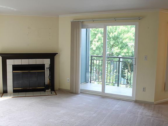 Living Room with Fireplace, Outdoor Patio and Storage
