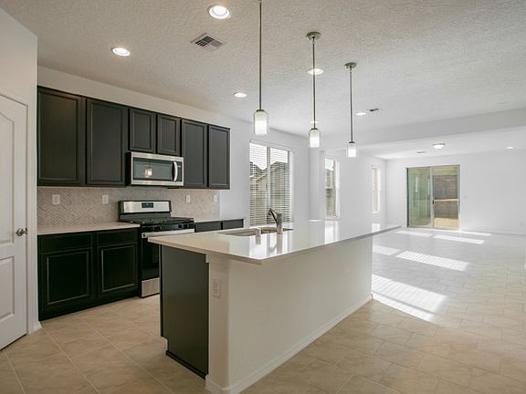 The Hewitt s open floor plan seamlessly connects the kitchen, cafe, and gathering room.
