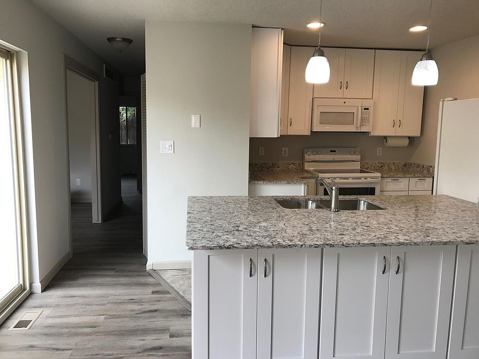 Quartz kitchen, pendant lights, updated cabinets, appliances