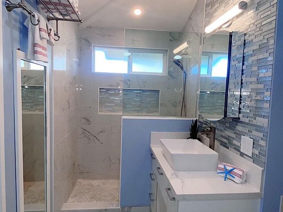 Bath Room: Renovated stylish bathroom.