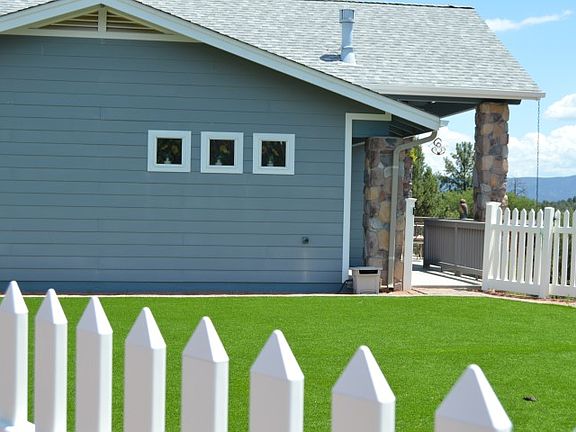 Fenced astroturf f dog yard