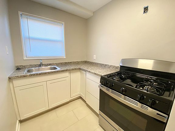 Kitchen (upper cabinets & built in microwave to be installed prior to move in)