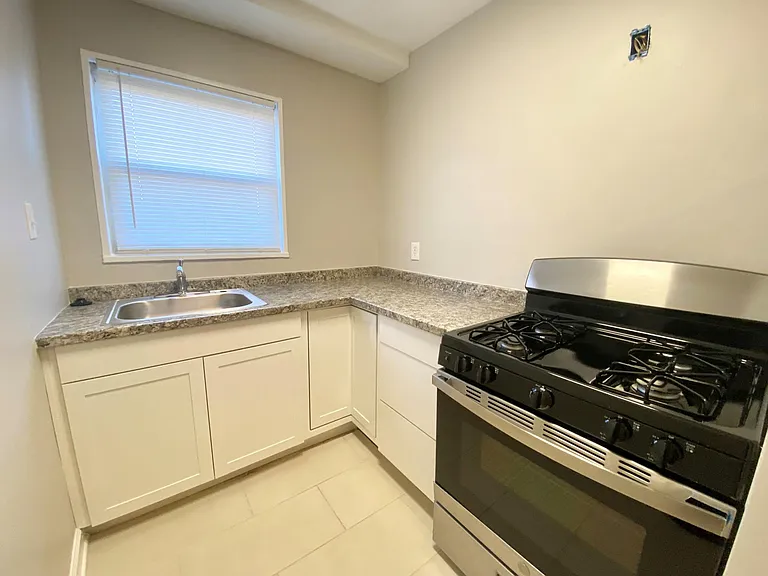 Kitchen (upper cabinets & built in microwave to be installed prior to move in)