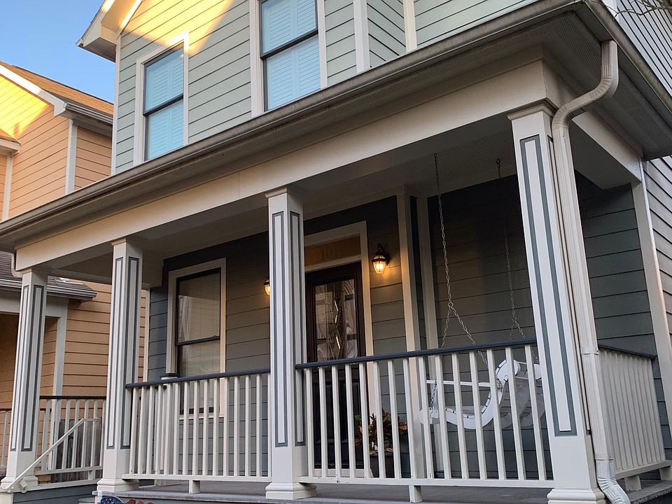 Cute home with covered porch and loveseat swing