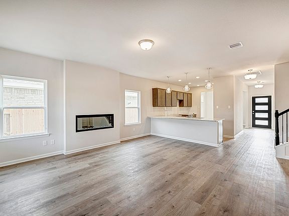 The Caldwell- Family Room into Kitchen. Home under construction. Sample floor plan photo used for i