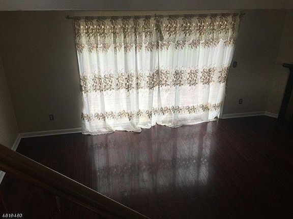 Living room , with sliding doors to deck and backyard!