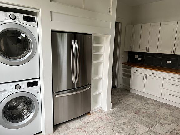 All stainless steel appliances and built in washer/dryaer