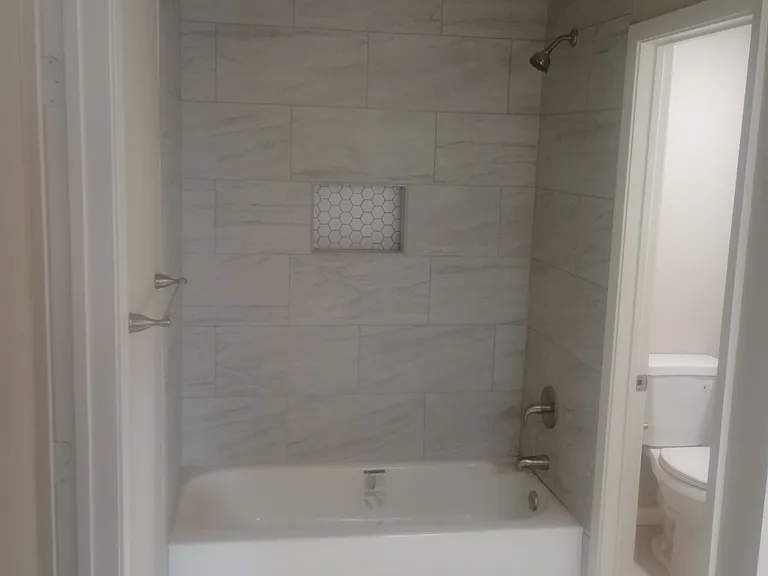 Master bathroom completely remodeled with shower/bath and separate toilet area