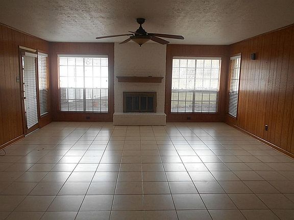 MASSIVE LIVING ROOM WITH CERAMIC TILE AND FIREPLACE