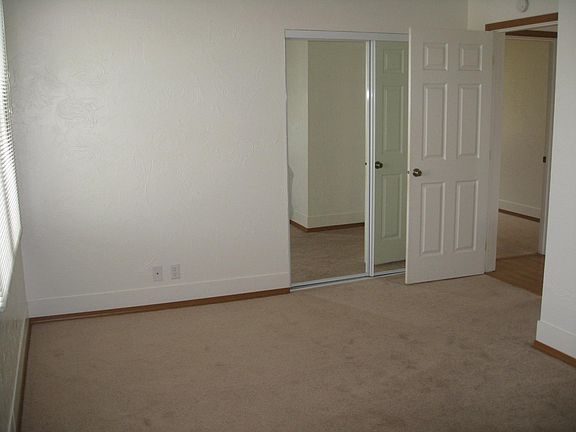 There is a mirrored wardrobe closet in each bedroom.