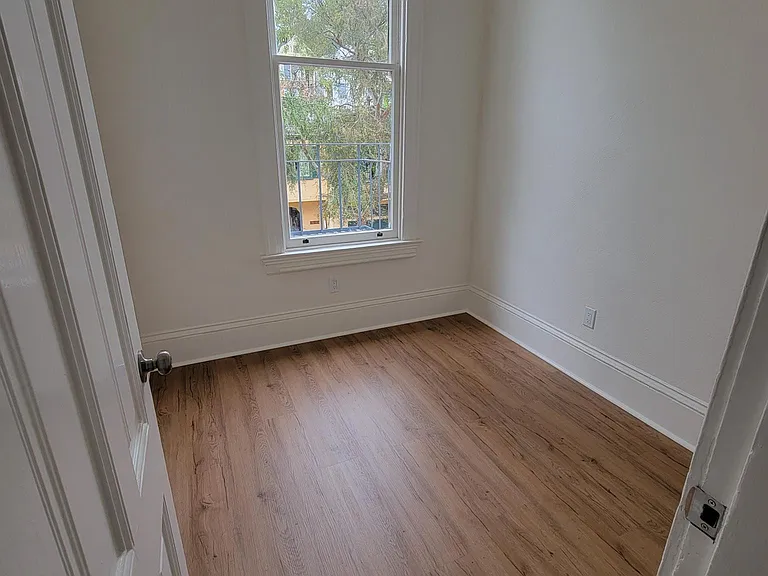189 A bedroom. It is a small bedroom intended for 1 person. Queen bed may not fit.