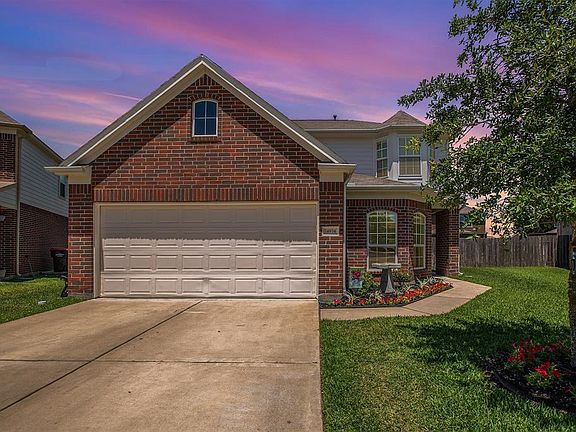2 car garage with double-wide driveway.