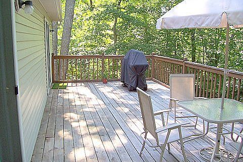 Large deck with french doors to kit. 