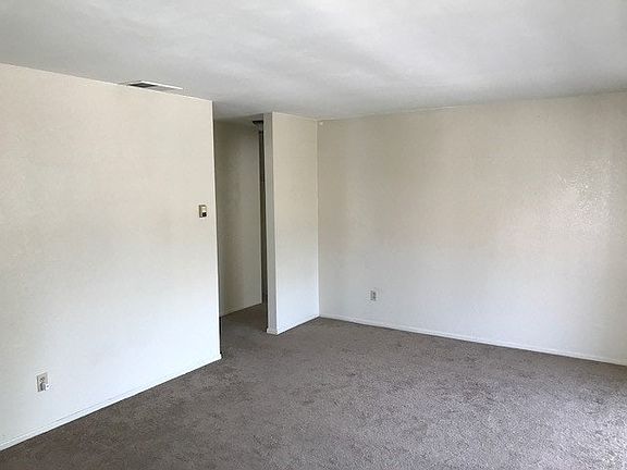 spacious living room with private balcony