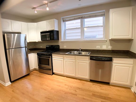 Stainless Kitchen Appliances, Granite Tops, Harwood Floors, Microwave, and Dishwasher.