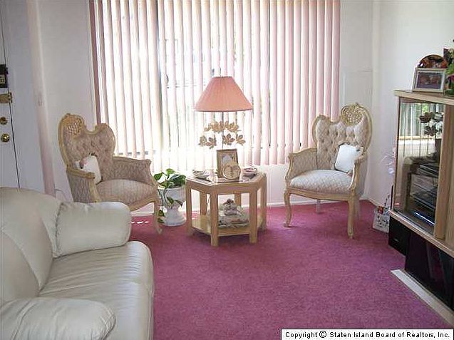FORMAL LIVING RM AND INTO THE FORMAL DINING ROOM