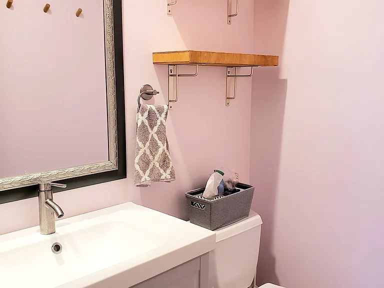 2nd full bathroom with floating vanity and storage
