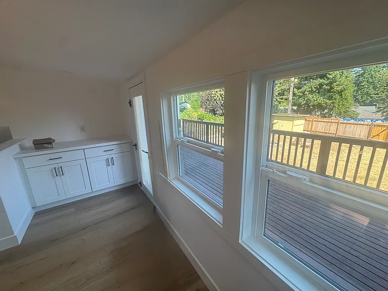 view of deck off of kitchen with door accessing deck from kitchen