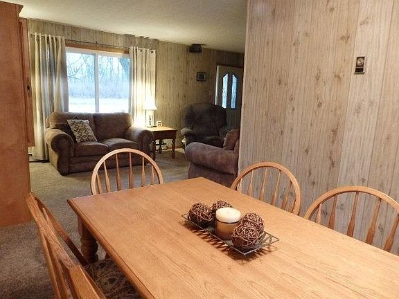 Dining room near kitchen, adjoining living room.