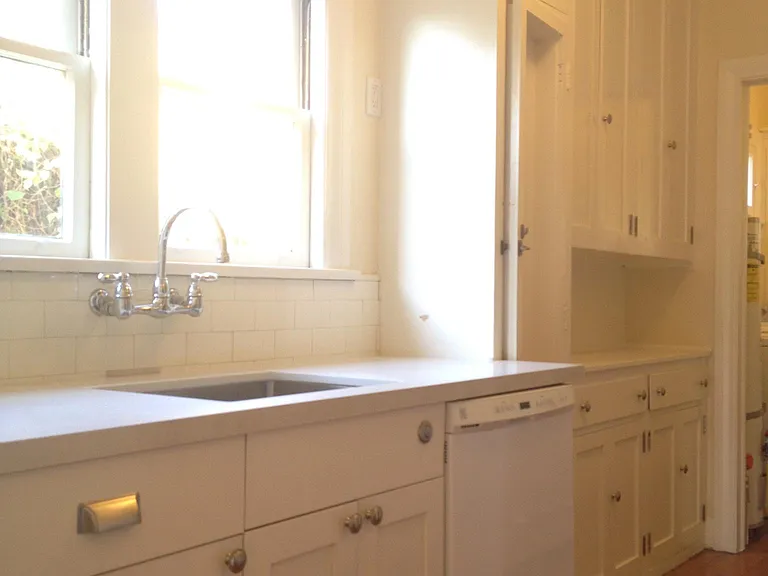 Vintage style kitchen with dishwasher, garbage disposal and quartz countertop