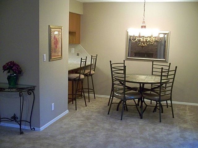 Dining area with contemporary new chandelier.