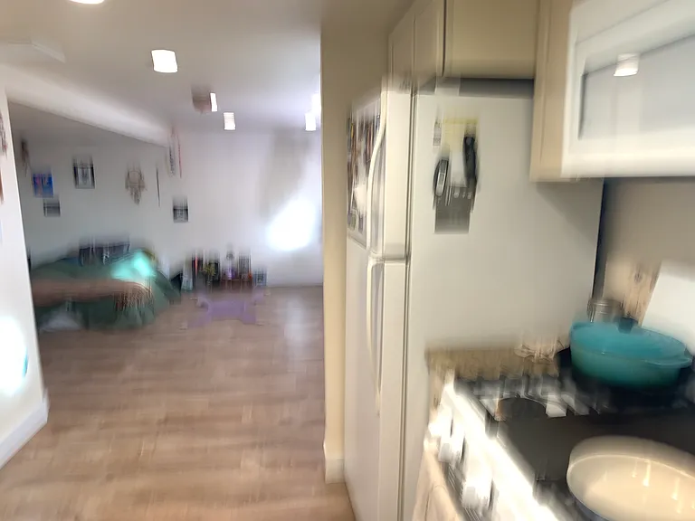 Kitchen looking to living room area
