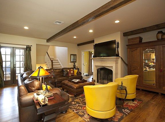 Exquisite hardwoods and beams in den