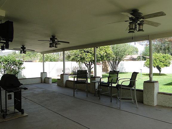 Covered patio with natural gas BBQ, Tv, ceiling fans, misting system