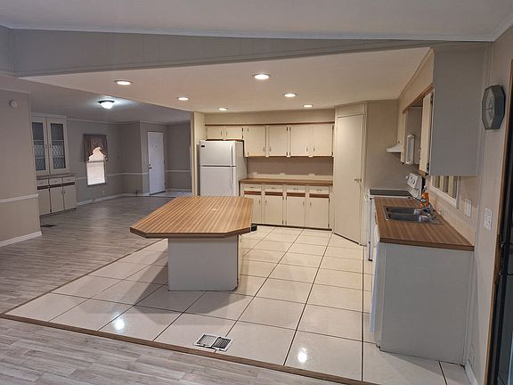 Kitchen and view to house entrance