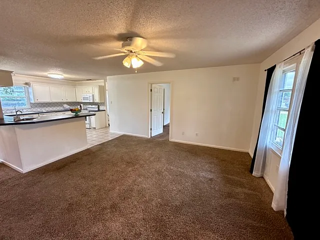 View of dining room and kitchen.