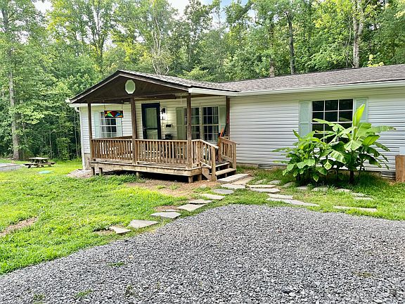 4 parking spaces, covered front porch