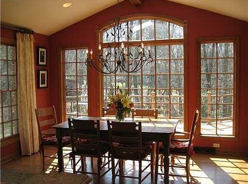This eat-in area features 11 ft vaulted ceilings & a view of the back yard