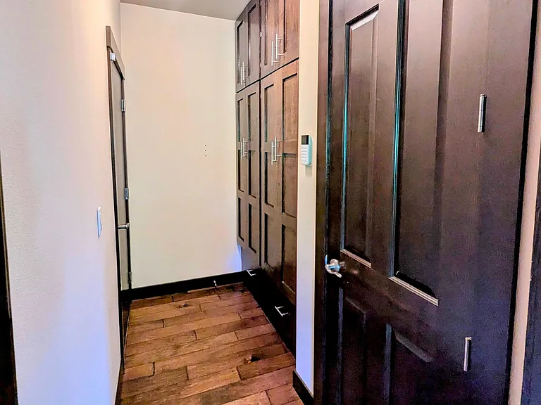 Entrance from garage on the left with coat and shoes closets with plenty storage.