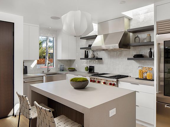 Chef's kitchen! Wolf oven/convection with 4 burners and griddle. Subzero restaurant quality fridge, wine fridge, microwave drawer, tons of storage, Caesarstone counter tops. Custom Zia tile Zellige back splash.