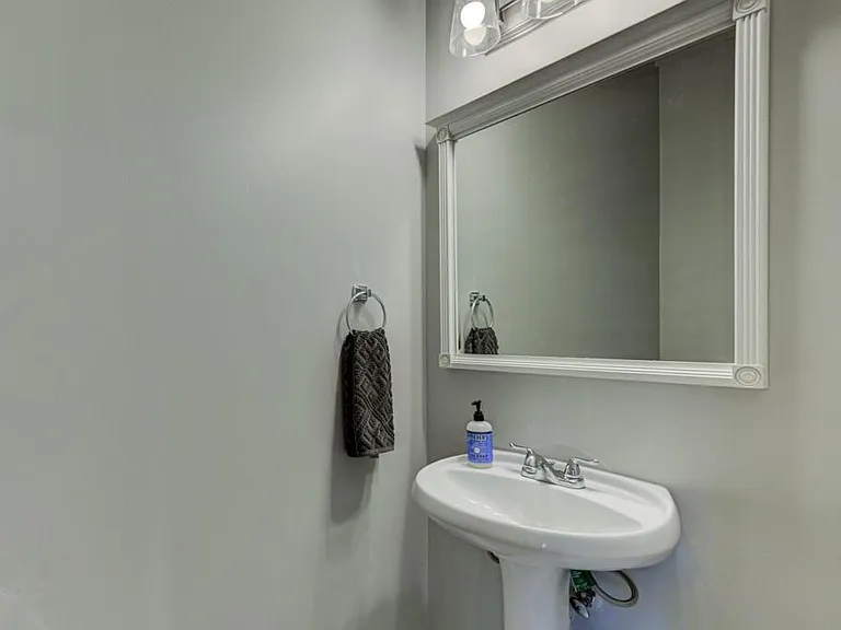 Half bathroom on main level with living room, kitchen and dining room.