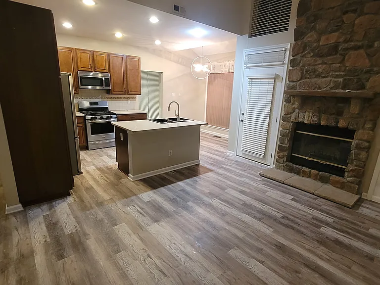 Living - Fireplace is just for looks but there is a door to the deck