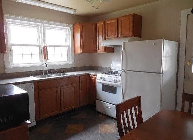Kitchen featuring new cabinets and appliances