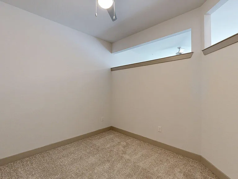 Spacious apartment Bedroom with Carpet Floor.