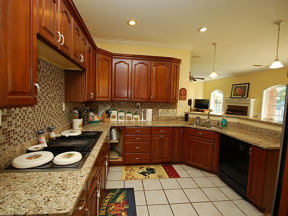The kitchen also includes its own breakfast bar and pantry.