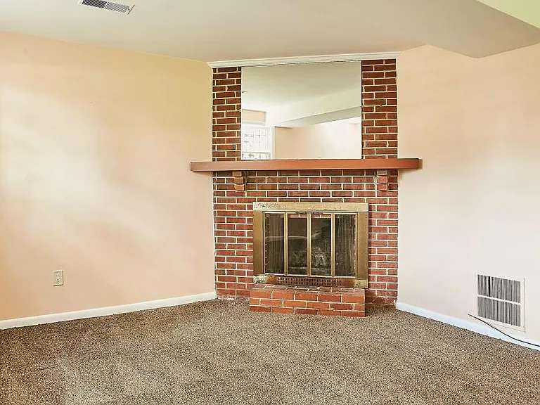 Lower level fireplace in living area