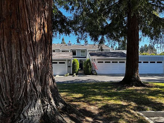 Front of Home with view through front area trees