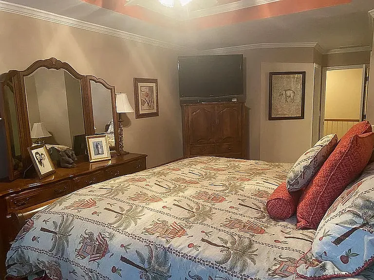 Upper sleeping level Master BR featuring ceiling Fan and Tray ceiling