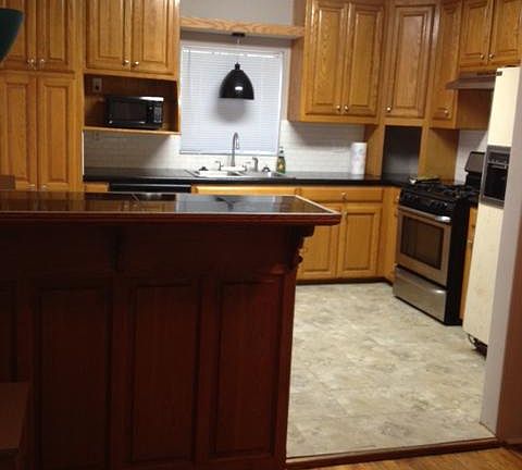 Openness of kitchen into versatile space aside it.