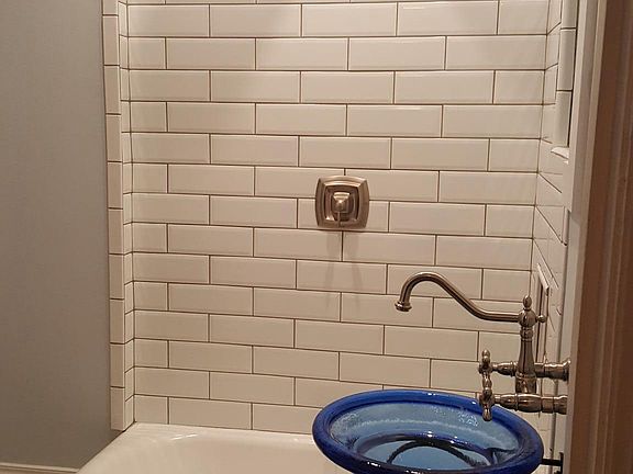 Updated tile rain head showe8r and vessel sink