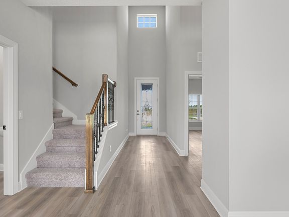 The entryway is highlighted by gorgeous high ceilings.