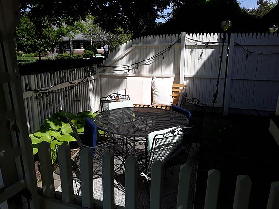 Private side patio overlooking park and library view 2 with library in background