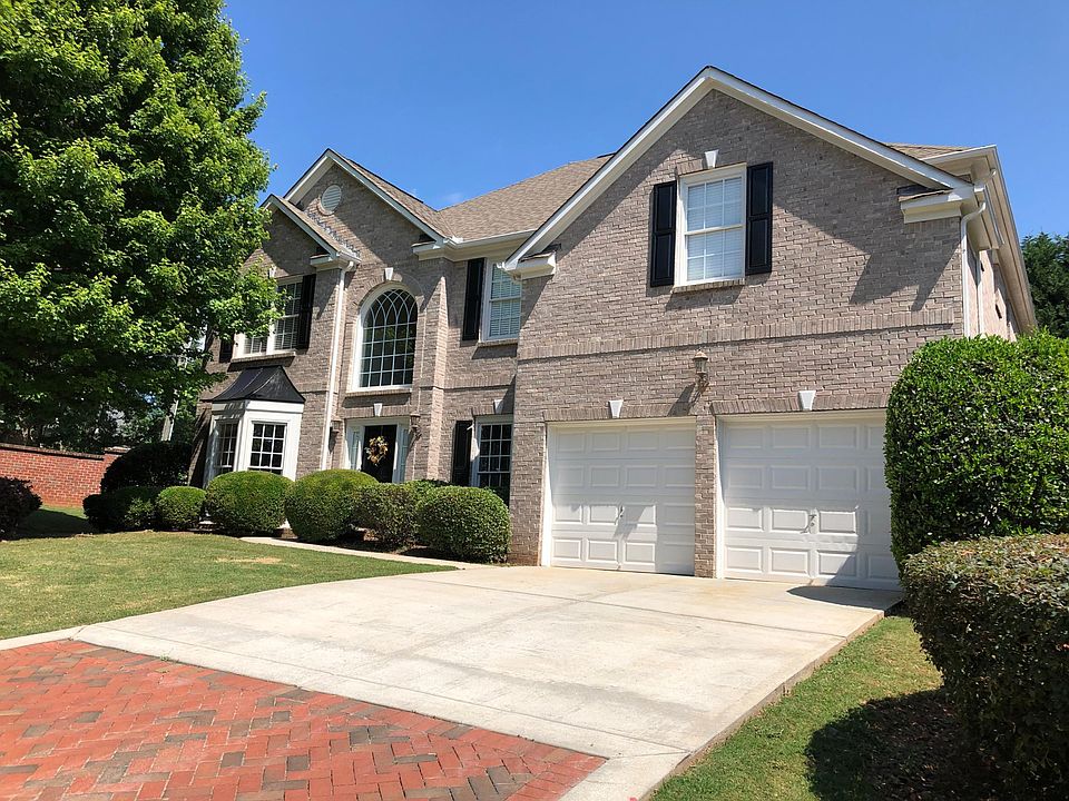 Corner lot with serpentine brick wall.