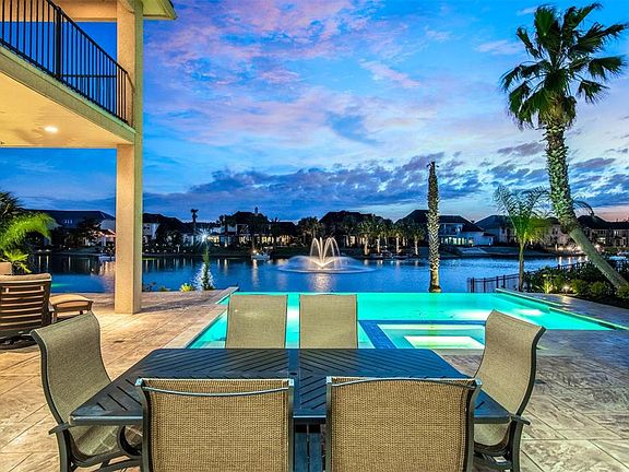 This beautiful lake fountain is situated directly across the back patio of this home. You will never tire of this view!