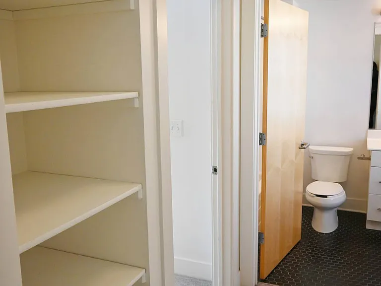 Shelving in a hallway in a townhome at The Sawyer.
