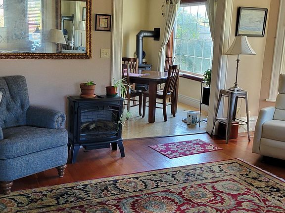 Living room electric stove and chairs